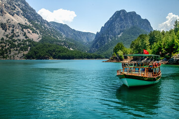 Naklejka premium Oymapinar Lake, Turkey. Landscape of a mountain lake. Emerald water reservoir behind the dam Oymapinar. Green Canyon in Manavgat region, Turkey. Travel concept.