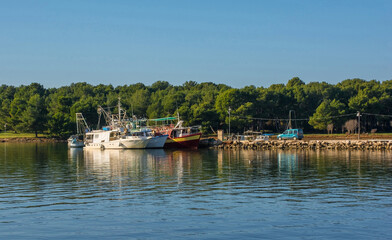 Fototapeta na wymiar Fishing boats on the coast of Medulin in Istria, Croatia. December