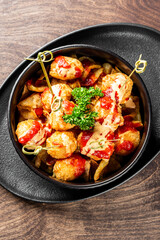 Fried Mozzarella Cheese Balls with Sauce in bowl