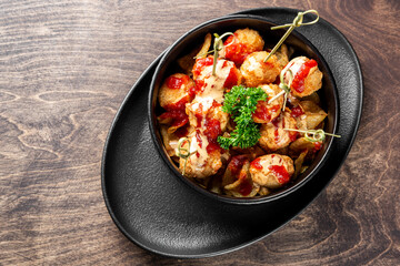 Fried Mozzarella Cheese Balls with Sauce in bowl