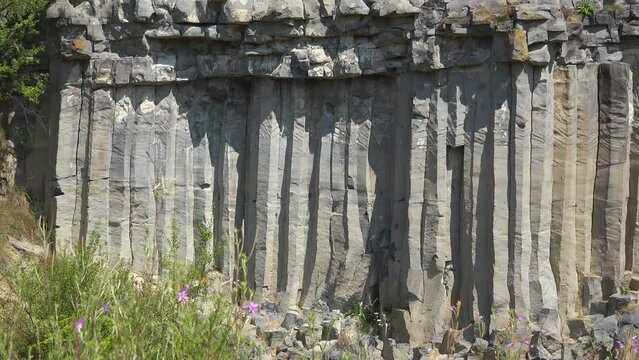 The volcanic basalt columns rock wall of Racos in Romania