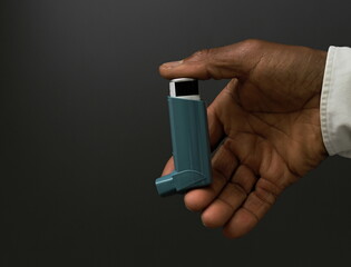 man with respiratory inhaler  puff on grey background with people stock image stock photo   