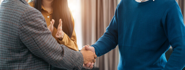 Close up two men shake hands at business meeting, office negotiations. Making deal sign, conclude contract, reach agreement, formal greeting, strike bargain. Successful negotiations. - obrazy, fototapety, plakaty