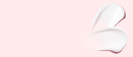 Set of cream strokes on a pink background. Empty space