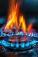 A close up shot of a gas burner on a stove. Perfect for illustrating cooking, home appliances, or kitchen concepts