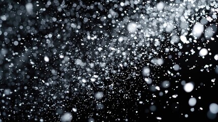A black and white photo capturing the beauty of falling snow. Perfect for winter-themed designs and holiday projects