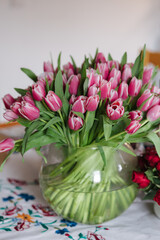 Different bouquets of flowers at home. Present for 8 March. Woman's day. Home mood