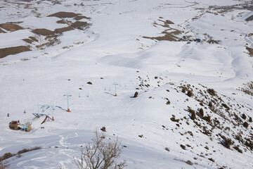 Natural landscape, mountain slope. Active leisure, winter sports. Cableway for skiers and...