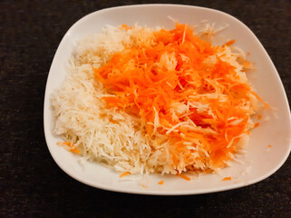 Winter salad of carrots and celery served on a white plate