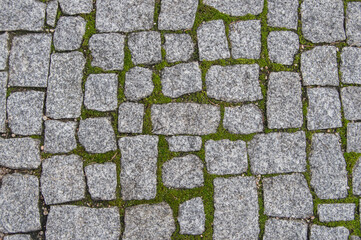 background with granite stone pavers with grass at the intersections