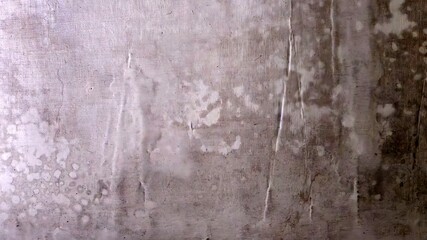 Grungy concrete wall texture with scratched paint.
