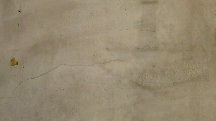 Grungy concrete wall texture with scratched paint.