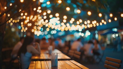 People hanging out having and listening to music together at roadside Restaurant on bokeh background - obrazy, fototapety, plakaty