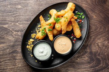 crispy shrimp tempura with garlic sauce on plate