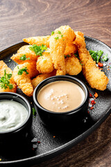 crispy shrimp tempura with garlic sauce on plate