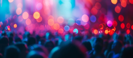 Blurred crowd at music festival creates a and creative defocused image - obrazy, fototapety, plakaty