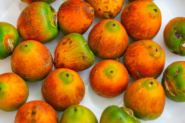 Rare and exotic fruit of the peach palm (Bactris gasipaes), typical fruit of the Brazilian tropical forests, Amazonas, Pará, Rondônia and Acre