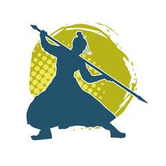 Silhouette of a wushu martial artist in action pose with a spear weapon. Silhouette of a fighter carrying a spear weapon.