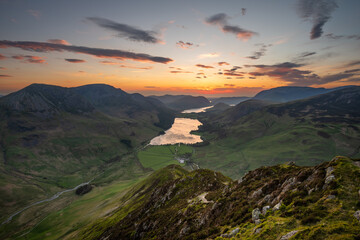 Dramatic Summer sunset seen from Fleetwith Pike overlooking Buttermere in The Lake District, UK.