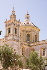 Fototapeta na wymiar Dome and bell tower of St. Paul's Collegiate Church in Rabat, Malta