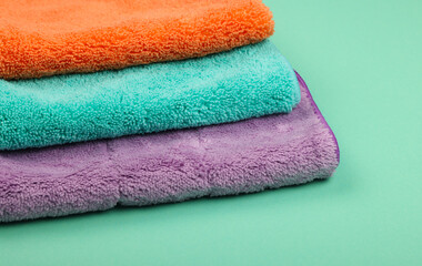 Several household microfiber clothes and mops