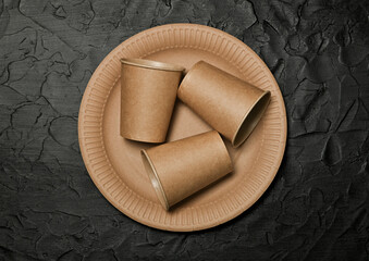 Disposable brown paper plate and coffee cups