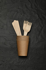 Disposable brown paper coffee cup with forks