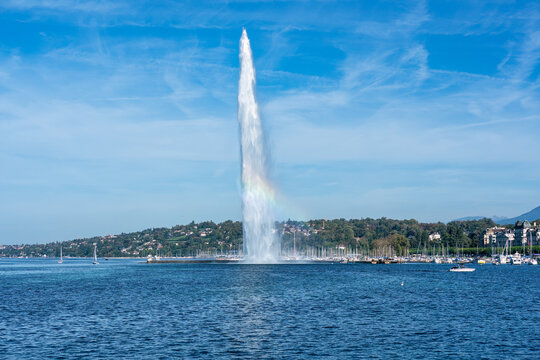 The Jet d'Eau landmark large fountain with rainbow in Geneva, Switzerland