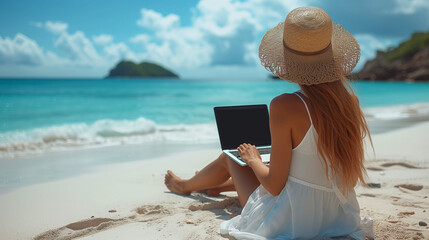 Woman with hat, traveler sitting on the beach working with her laptop. Digital nomad, remote work and relax