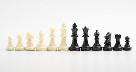 White and black chess include king queen horse ship and pawn on white background.