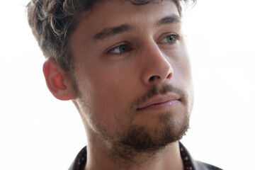 Obraz premium A close-up portrait of a man looking thoughtfully into the distance