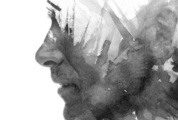 A black and white double exposure paintography portrait of a man's profile