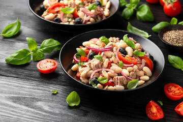 White bean tuna salad with olive, red onion, tomatoes. Healthy food