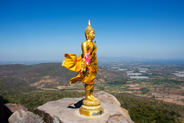 Buddha on cliff of Khao Phraya Doen Thong mountain for thai people travelers travel visit trail...