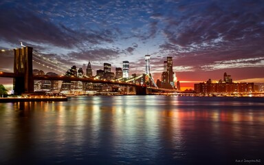 Fototapeta na wymiar New York Skyline with Brooklyn Bridge Hudson River Manhatten dur