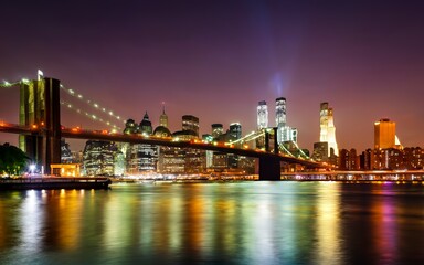 Panorama of downtown Manhattan and the Brooklyn bridge at night from Brooklyn in NYC