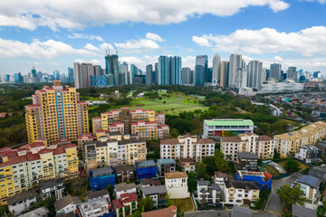 Taguig, Metro Manila, Philippines - Feb 03, 2024: Aerial of upscale houses and condominiums in...