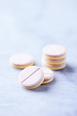 Vitamin effervescent Tablets on bright stone background. Close up. Copy space. 