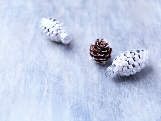 Christmas ornaments on bright wooden background. Soft focus. Close up. Copy space.