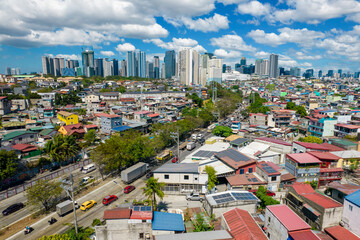 Taguig, Metro Manila, Philippines - Feb 03, 2024: Aerial of C5 road, old Taguig, Mckinley Village,...