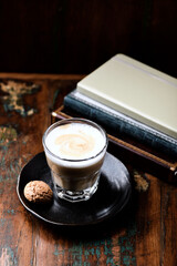 Coffee with milk on rustic wooden background. Soft focus. Close up. Copy space.	