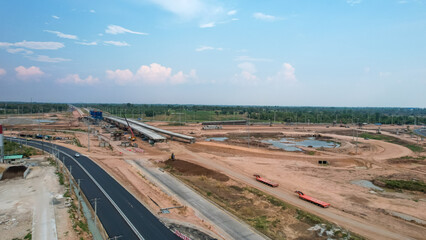 View from drone of A large bridge is under construction,Expanding roads outside the city to increase traffic lanes