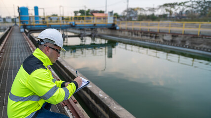 Environmental engineers work at wastewater treatment plants,Water supply engineering working at Water recycling plant for reuse