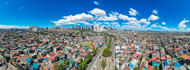Taguig, Metro Manila, Philippines - Panoramic Aerial of C5 road, poorer areas of Taguig, upscale...