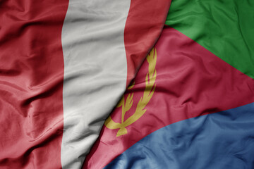 big waving national colorful flag of eritrea and national flag of peru .