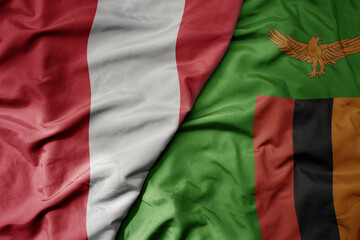 big waving national colorful flag of zambia and national flag of peru .