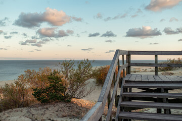 Sand dune, sea, horizon line and clouds at sunset in the evening, Efa Dune