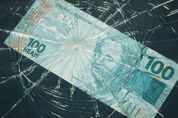 Brazil money, Fall of the Brazilian currency, Weakening of the real 100 Reais banknote lying behind...