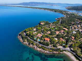 Naklejka premium aerial view of the Argentario coast, in the background the Orbetello lagoon.