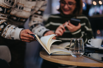 Young professionals collaborating in a cozy cafe environment.